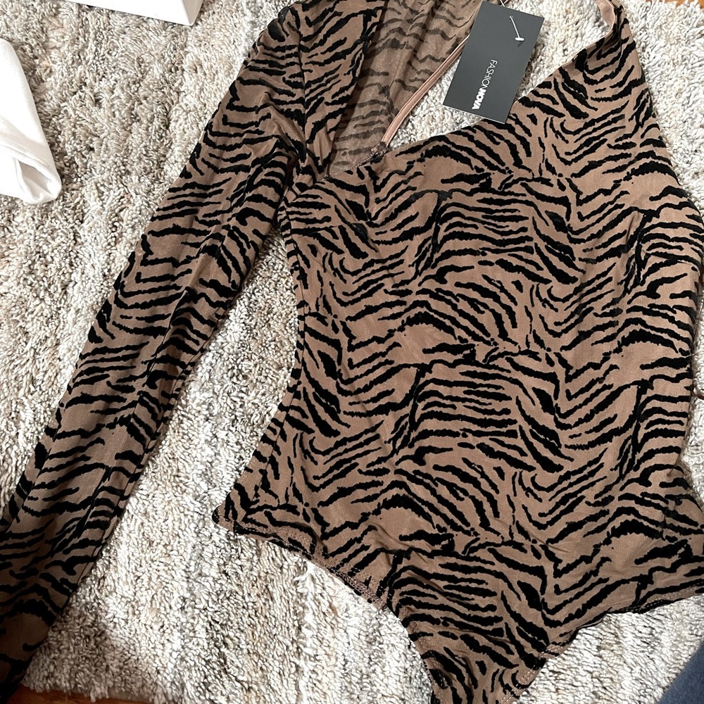 Brand new bodysuit. Size Medium.